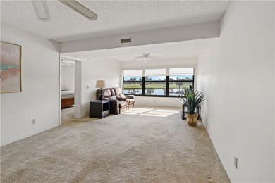 Enjoy resort-style living in this bright 2nd-floor corner unit on Vista Plantation Golf Club in Florida - for sale on GolfHomes.com, golf home, golf lot