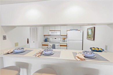 Enjoy resort-style living in this bright 2nd-floor corner unit on Vista Plantation Golf Club in Florida - for sale on GolfHomes.com, golf home, golf lot