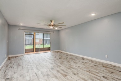 Welcome to this charming first-floor end-unit condo located in on East Bay Golf Club in Florida - for sale on GolfHomes.com, golf home, golf lot