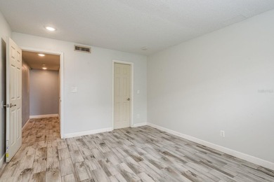 Welcome to this charming first-floor end-unit condo located in on East Bay Golf Club in Florida - for sale on GolfHomes.com, golf home, golf lot