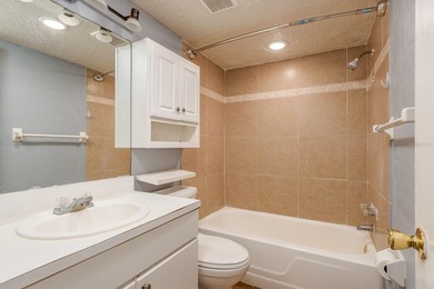 Welcome to this charming first-floor end-unit condo located in on East Bay Golf Club in Florida - for sale on GolfHomes.com, golf home, golf lot