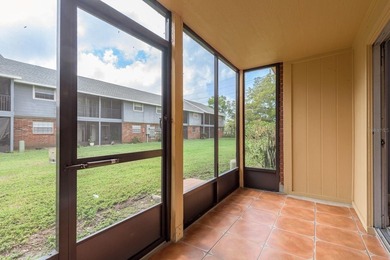 Welcome to this charming first-floor end-unit condo located in on East Bay Golf Club in Florida - for sale on GolfHomes.com, golf home, golf lot