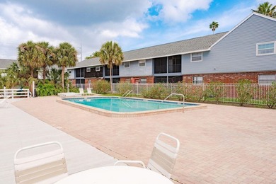 Welcome to this charming first-floor end-unit condo located in on East Bay Golf Club in Florida - for sale on GolfHomes.com, golf home, golf lot