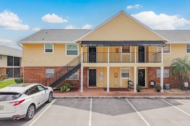 Welcome to this charming first-floor end-unit condo located in on East Bay Golf Club in Florida - for sale on GolfHomes.com, golf home, golf lot