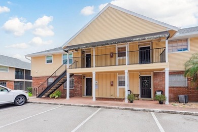 Welcome to this charming first-floor end-unit condo located in on East Bay Golf Club in Florida - for sale on GolfHomes.com, golf home, golf lot