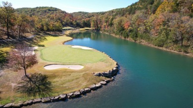 This beautifully appointed 2-bedroom, 2-bathroom fully furnished on Ledgestone Country Club and Golf Course in Missouri - for sale on GolfHomes.com, golf home, golf lot