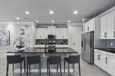 Discover luxury living in the heart of Viera at 3222 Casterton on Duran Golf Course in Florida - for sale on GolfHomes.com, golf home, golf lot