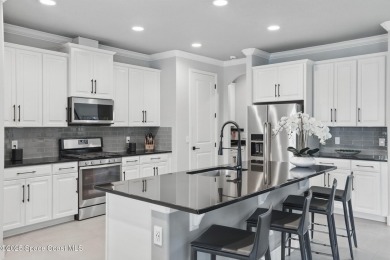 Discover luxury living in the heart of Viera at 3222 Casterton on Duran Golf Course in Florida - for sale on GolfHomes.com, golf home, golf lot