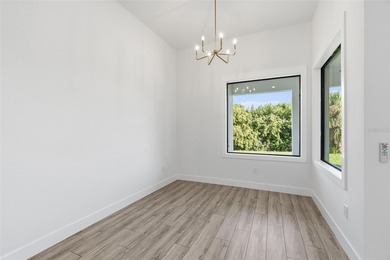 Welcome to this luxurious, modern, custom-built home perfectly on Rotonda Golf and Country Club - Long Marsh  in Florida - for sale on GolfHomes.com, golf home, golf lot