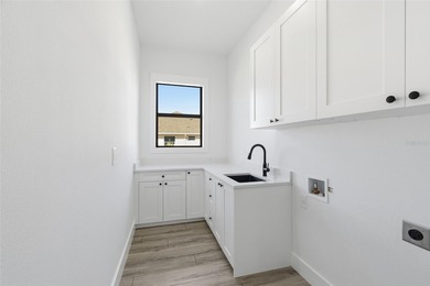 Welcome to this modern, custom-built home perfectly situated on on Rotonda Golf and Country Club - Long Marsh  in Florida - for sale on GolfHomes.com, golf home, golf lot