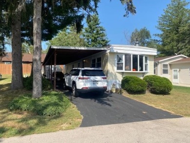 Discover your perfect lake access retreat with this inviting on Lake Ripley Country Club in Wisconsin - for sale on GolfHomes.com, golf home, golf lot