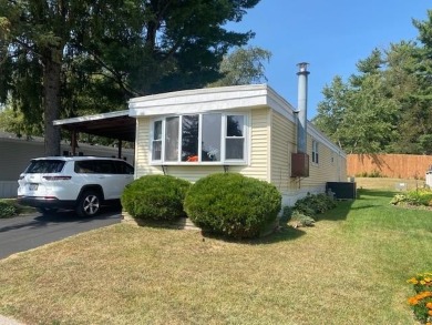 Discover your perfect lake access retreat with this inviting on Lake Ripley Country Club in Wisconsin - for sale on GolfHomes.com, golf home, golf lot