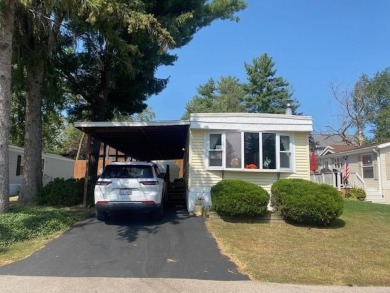 Discover your perfect lake access retreat with this inviting on Lake Ripley Country Club in Wisconsin - for sale on GolfHomes.com, golf home, golf lot