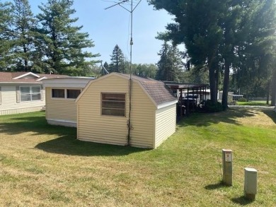 Discover your perfect lake access retreat with this inviting on Lake Ripley Country Club in Wisconsin - for sale on GolfHomes.com, golf home, golf lot