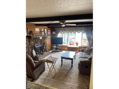 Discover your perfect lake access retreat with this inviting on Lake Ripley Country Club in Wisconsin - for sale on GolfHomes.com, golf home, golf lot