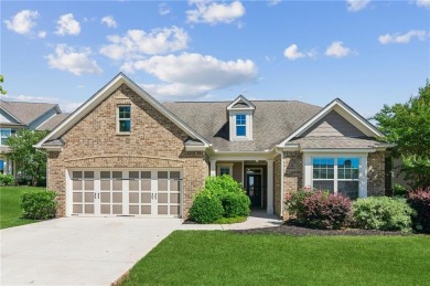 Nestled in the sought-after Traditions of Braselton golf course on Traditions of Braselton Golf Club in Georgia - for sale on GolfHomes.com, golf home, golf lot