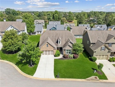 Nestled in the sought-after Traditions of Braselton golf course on Traditions of Braselton Golf Club in Georgia - for sale on GolfHomes.com, golf home, golf lot