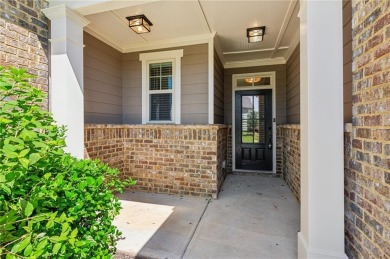 Nestled in the sought-after Traditions of Braselton golf course on Traditions of Braselton Golf Club in Georgia - for sale on GolfHomes.com, golf home, golf lot