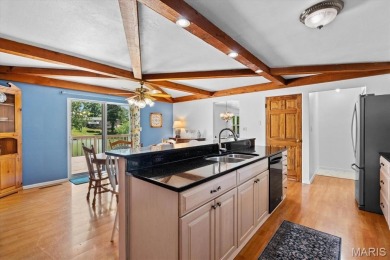 Discover your dream home at this stunning waterfront oasis on Tamarack Country Club in Illinois - for sale on GolfHomes.com, golf home, golf lot