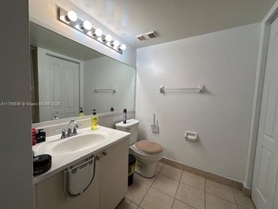 SPACIOUS BRIGHT 2 BEDROOM 2 BATHROOM AT THE GREENS AT DORAL on Jim McLean Signature Course in Florida - for sale on GolfHomes.com, golf home, golf lot