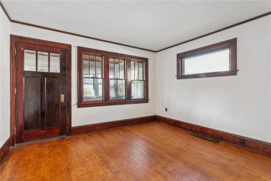 This 3-bedroom, 2-bath home features beautiful natural woodwork on Phalen Park Golf Course in Minnesota - for sale on GolfHomes.com, golf home, golf lot