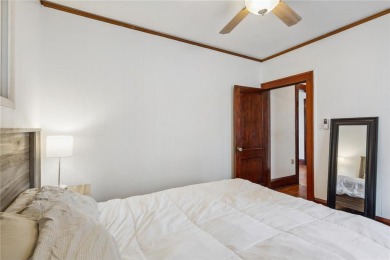 This 3-bedroom, 2-bath home features beautiful natural woodwork on Phalen Park Golf Course in Minnesota - for sale on GolfHomes.com, golf home, golf lot