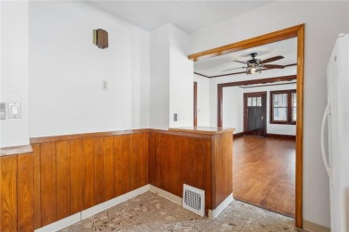 This 3-bedroom, 2-bath home features beautiful natural woodwork on Phalen Park Golf Course in Minnesota - for sale on GolfHomes.com, golf home, golf lot