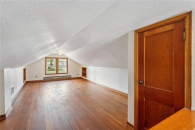 This 3-bedroom, 2-bath home features beautiful natural woodwork on Phalen Park Golf Course in Minnesota - for sale on GolfHomes.com, golf home, golf lot