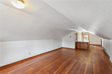 This 3-bedroom, 2-bath home features beautiful natural woodwork on Phalen Park Golf Course in Minnesota - for sale on GolfHomes.com, golf home, golf lot