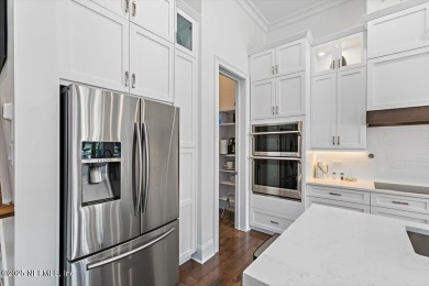 Experience waterfront living at its finest in this elegant on Pablo Creek Club in Florida - for sale on GolfHomes.com, golf home, golf lot