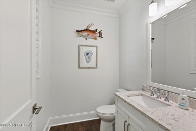 Experience waterfront living at its finest in this elegant on Pablo Creek Club in Florida - for sale on GolfHomes.com, golf home, golf lot