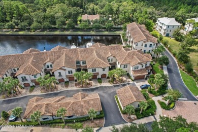 Experience waterfront living at its finest in this elegant on Pablo Creek Club in Florida - for sale on GolfHomes.com, golf home, golf lot