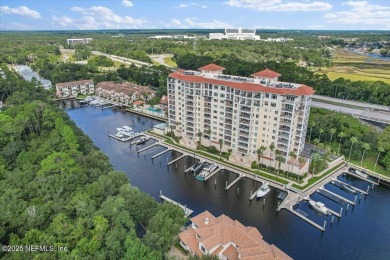 Experience waterfront living at its finest in this elegant on Pablo Creek Club in Florida - for sale on GolfHomes.com, golf home, golf lot