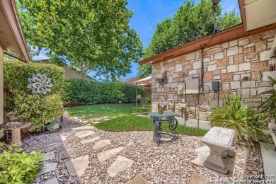 SHOWCASE GARDEN. A garden, rich in color & beauty, lies behind on Northern Hills Golf Club in Texas - for sale on GolfHomes.com, golf home, golf lot