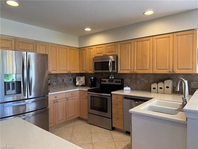 Welcome to this beautifully maintained first-floor end-unit on Crown Colony Golf and Country Club in Florida - for sale on GolfHomes.com, golf home, golf lot