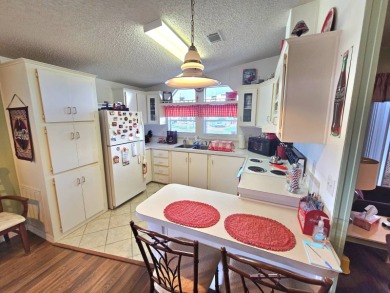 METICULOUS MAINTAINED HOME ON A PRIVATE CORNER LOT!!! This fully on Riverbend Golf and Country Club in Florida - for sale on GolfHomes.com, golf home, golf lot