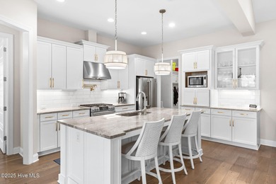 Modern luxury meets serene golf-course living in this immaculate on Members Club At St. James Plantation in North Carolina - for sale on GolfHomes.com, golf home, golf lot