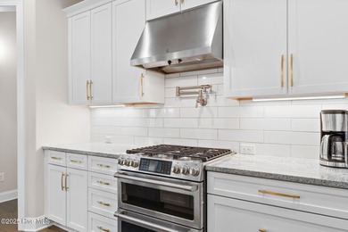 Modern luxury meets serene golf-course living in this immaculate on Members Club At St. James Plantation in North Carolina - for sale on GolfHomes.com, golf home, golf lot