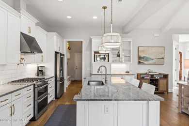 Modern luxury meets serene golf-course living in this immaculate on Members Club At St. James Plantation in North Carolina - for sale on GolfHomes.com, golf home, golf lot