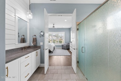 Modern luxury meets serene golf-course living in this immaculate on Members Club At St. James Plantation in North Carolina - for sale on GolfHomes.com, golf home, golf lot