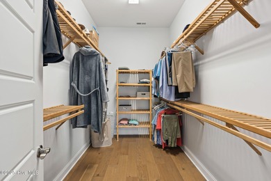 Modern luxury meets serene golf-course living in this immaculate on Members Club At St. James Plantation in North Carolina - for sale on GolfHomes.com, golf home, golf lot