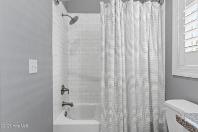 Modern luxury meets serene golf-course living in this immaculate on Members Club At St. James Plantation in North Carolina - for sale on GolfHomes.com, golf home, golf lot