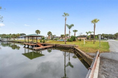 PRICE IMPROVEMENT! Your Waterfront Oasis awaits with this Canal on Plantation Inn and Golf Resort  in Florida - for sale on GolfHomes.com, golf home, golf lot