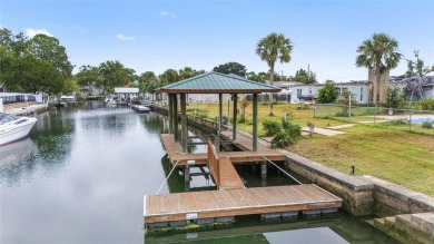 PRICE IMPROVEMENT! Your Waterfront Oasis awaits with this Canal on Plantation Inn and Golf Resort  in Florida - for sale on GolfHomes.com, golf home, golf lot