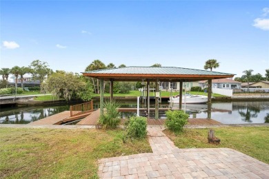 PRICE IMPROVEMENT! Your Waterfront Oasis awaits with this Canal on Plantation Inn and Golf Resort  in Florida - for sale on GolfHomes.com, golf home, golf lot