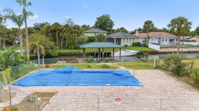 PRICE IMPROVEMENT! Your Waterfront Oasis awaits with this Canal on Plantation Inn and Golf Resort  in Florida - for sale on GolfHomes.com, golf home, golf lot