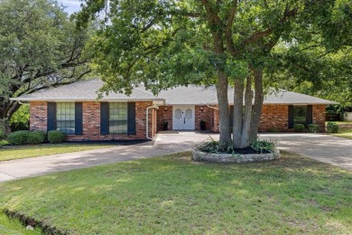 Classy and classic ranch style house nestled in Pecan Plantation on Pecan Plantation Country Club in Texas - for sale on GolfHomes.com, golf home, golf lot