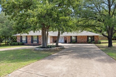 Classy and classic ranch style house nestled in Pecan Plantation on Pecan Plantation Country Club in Texas - for sale on GolfHomes.com, golf home, golf lot