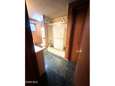 Located on a sprawling one-acre lot, this bi-level home offers on Iron Masters Country Club in Pennsylvania - for sale on GolfHomes.com, golf home, golf lot