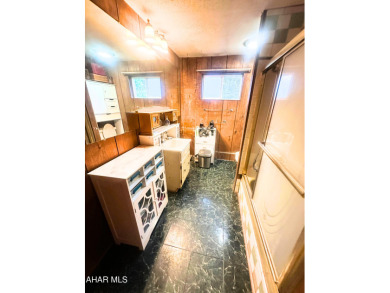 Located on a sprawling one-acre lot, this bi-level home offers on Iron Masters Country Club in Pennsylvania - for sale on GolfHomes.com, golf home, golf lot